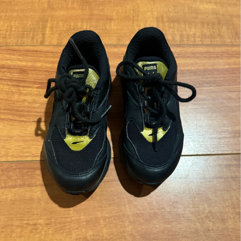 Puma Black and Gold Sneakers